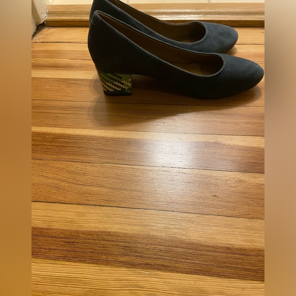 Navy suede pumps with patterned detail on the heel